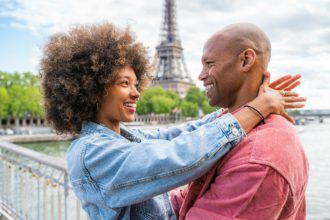 Afro-american beautiful couple in love visiting Paris